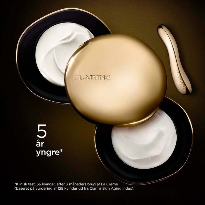 Clarins Precious Rich Cream on dark background, with text emphasising its power to make skin appear 5 years younger