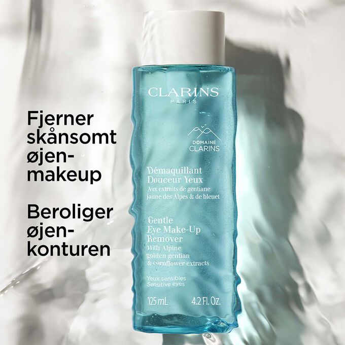 Packshot under vand af Clarins &oslash;jenmakeupfjerner med tekst om produktets beroligende og sk&aring;nsomme egenskaber.