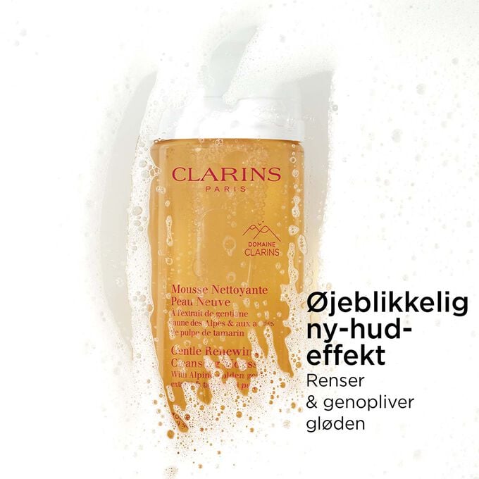 Packshot af den orange flaske med skummende ansigtsrens under skum med tekst om dens ny-hud-effekt.
