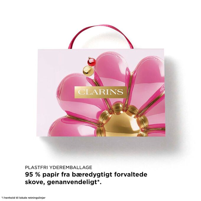 Clarins Lip Oils jules&aelig;t med tekst om toilettaske af 87 % genanvendte fibre til en b&aelig;redygtig julegave