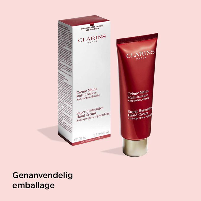 Tube of Clarins Super Restorative Hand Cream next to its packaging to illustrate the recyclable origin of the packaging