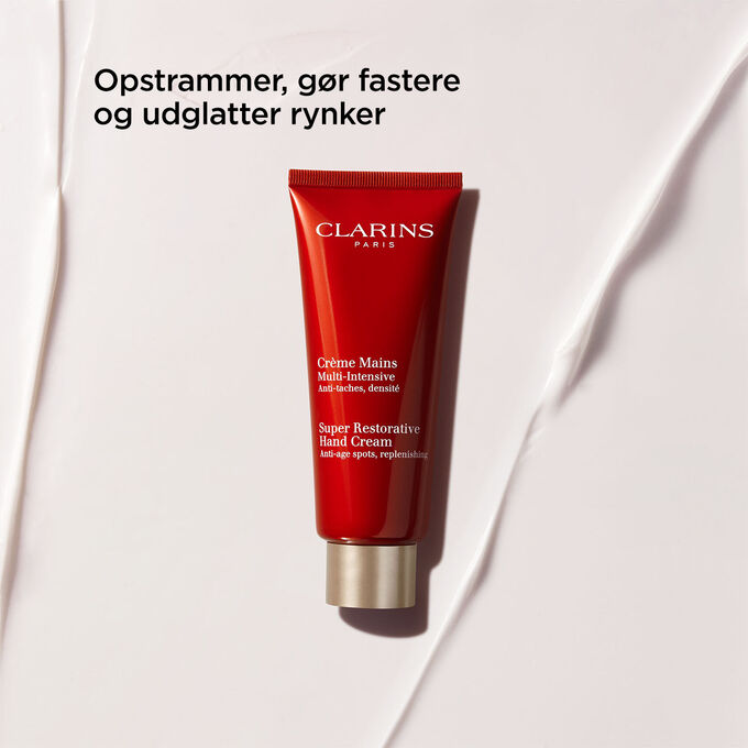 Packshot of Clarins Super Restorative Hand Cream, highlighting its tightening, firming, and wrinkle-smoothing benits.