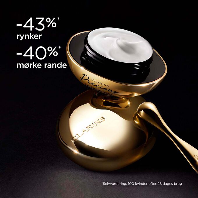 Clarins Precious Eyes eye cream on dark background, with text emphasising its power to make skin appear 5 years younger