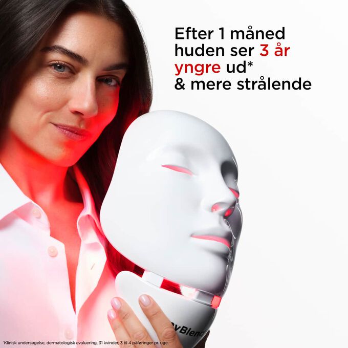 N&aelig;rbillede af model, der holder myLEDmask2 til ansigt og hals og fremh&aelig;ver dens fordele for at f&aring; huden til at se yngre, fastere og mere str&aring;lende ud
