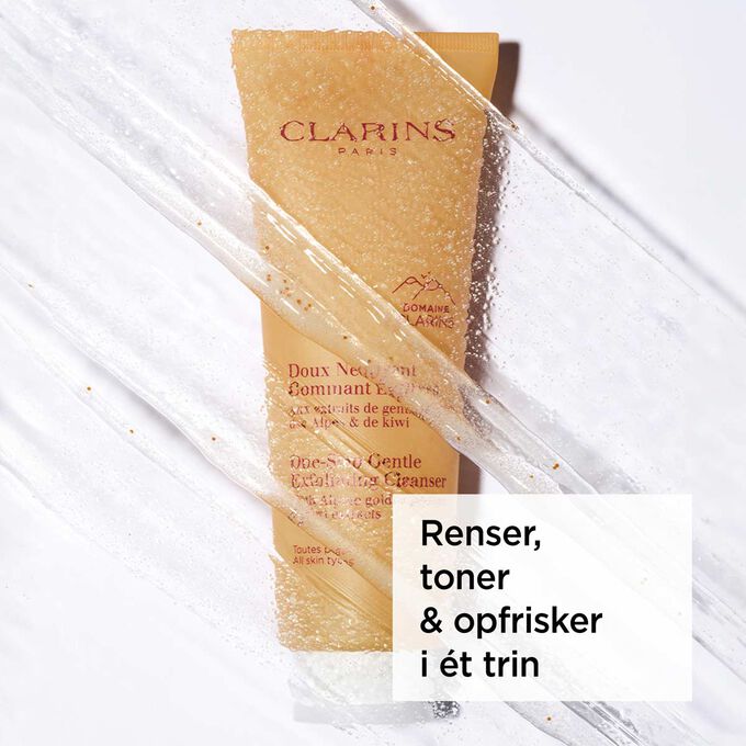 Packshot af den orange tube med ansigtsrens med tekst om dens 3-i-1-effekt: fjerner makeup, renser og eksfolierer.