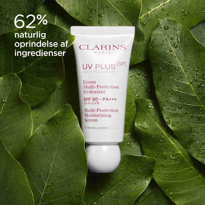 Packshot of Clarins UV Plus Anti-Pollution Translucent among mango leaves, highlighting 62% natural origin ingredients.